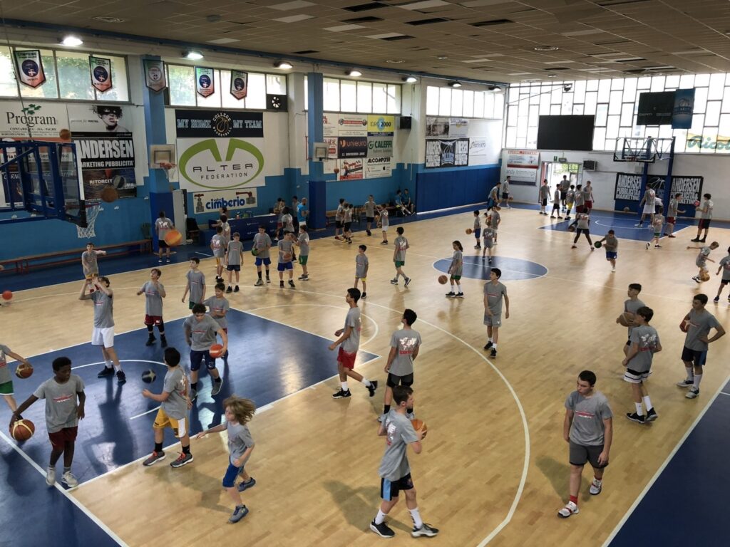 Youth players participating in an international basketball camp in Italy