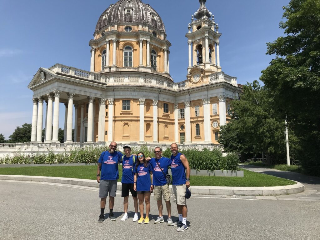 Basketball players and coaches sightseeing together during a basketball experience in Italy