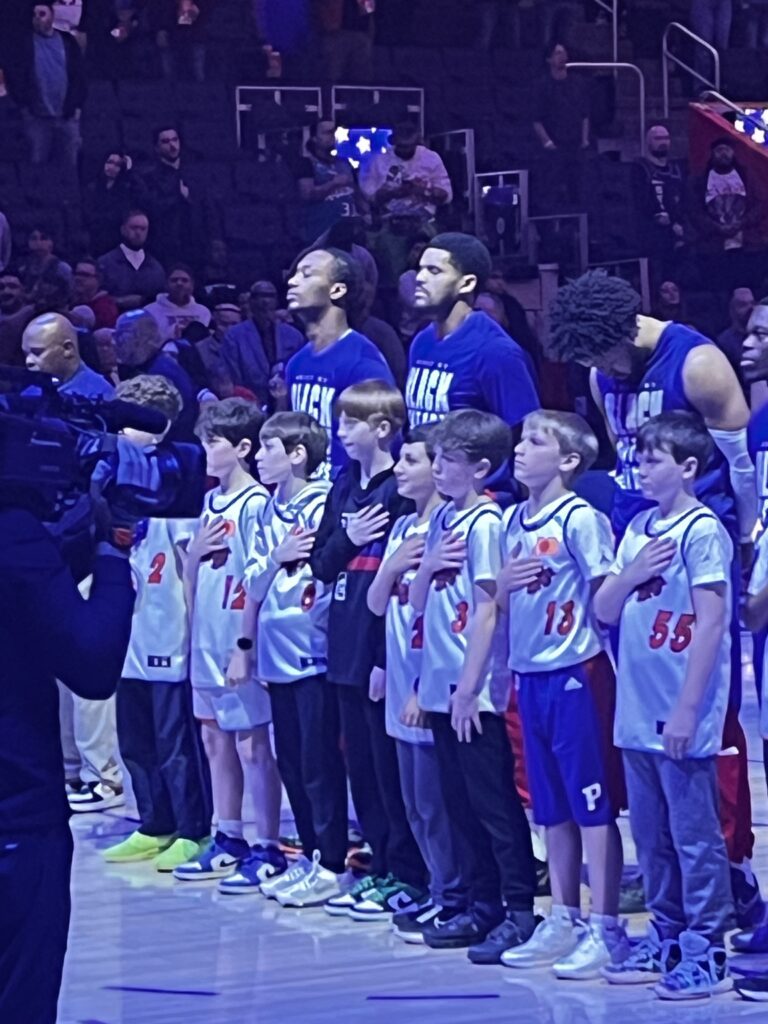 Always Basketball boys on the court during the National Anthem at a Detroit Pistons game