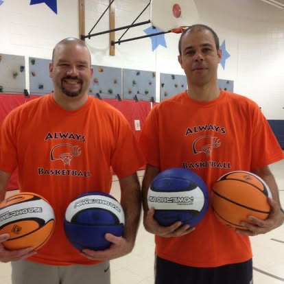 Coach Vitor Imbuzeiro and Coach Steve Claramunt holding basketballs during the early years of Always Basketball.