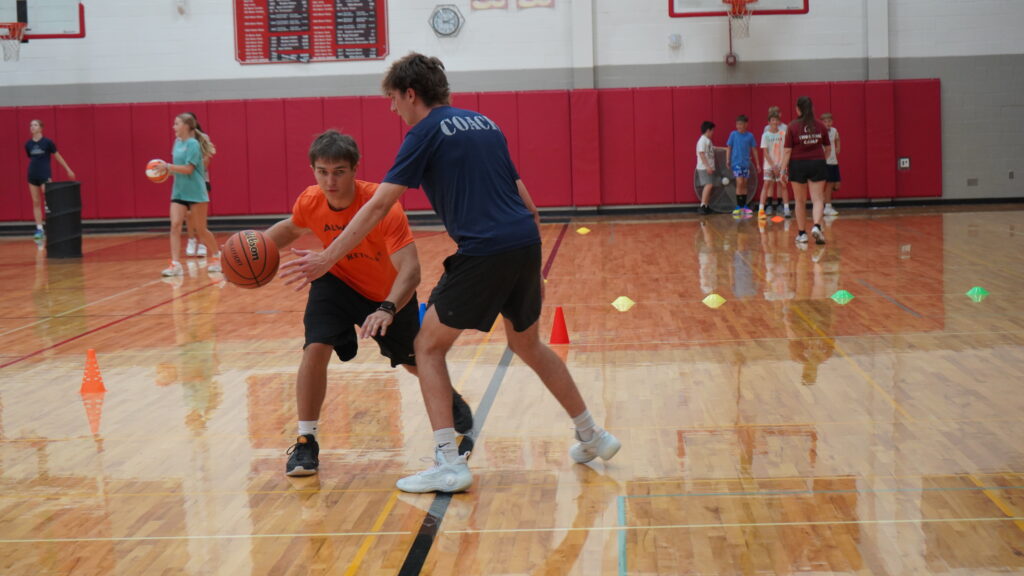 Always Basketball coach working with a player during basketball skills training in Northville, Michigan
